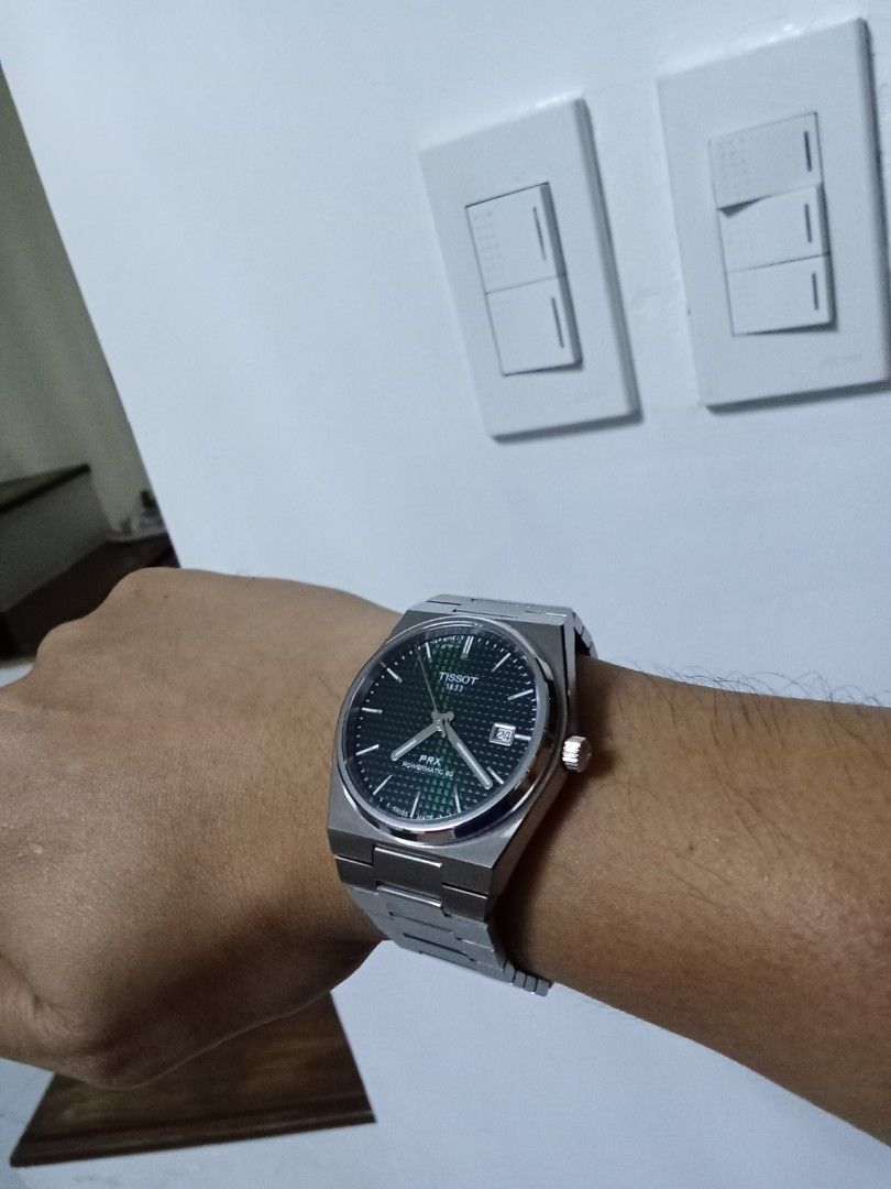 Tissot PRX Powermatic 80 Green Dial (Category: Luxury Watches) located in San Fernando. Submitted by fityrion (Listing ID 1394843492, Image 3). Description: - Authentic Tissot PRX Powermatic 80 -40mm - Striking green dial - Stainless steel bracelet - Includes original outer box, box manuals and warranty card - Features a date display -Still Negotiable.