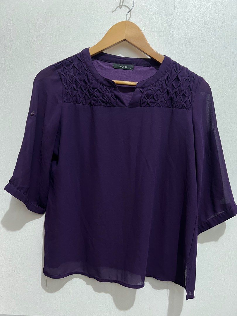 Xara Purple Blouse - Size S (Category: Blouses) located in Manila. Submitted by zapitup (Listing ID 1394926005, Image 2). Description: - Xara blouse in a lovely purple color - Size: Small - Unique textured design on the upper chest - Small slit at the neckline - Short sleeves - Relaxed fit.