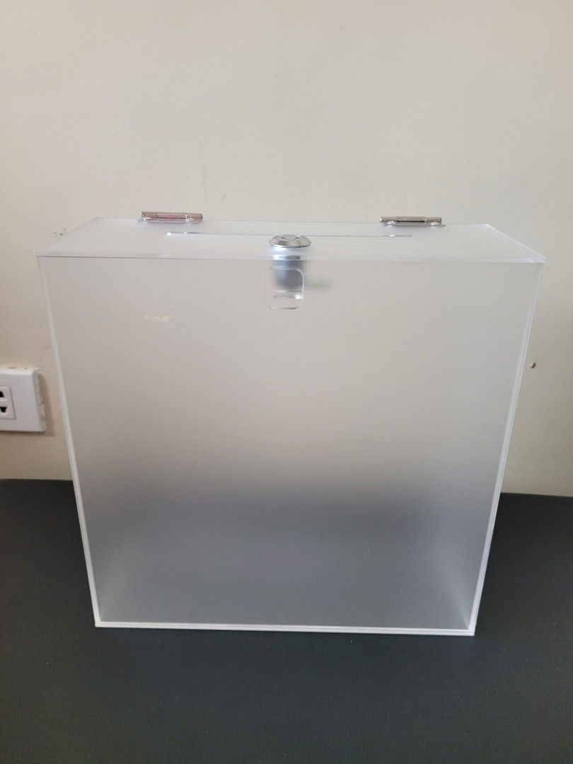 Frosted Acrylic Storage Box with Lock (Category: Storage Boxes & Baskets) located in Los Banos. Submitted by momo_mono (Listing ID 1394984806, Image 1). Description: - Secure acrylic storage box - Features a lock for added security - Easy-open hinges - Frosted finish for privacy - Sturdy and functional design - Simple, clean aesthetic - Suitable for various items - 25 x 25 x 10 cm (Length x Height x Width) used only once as my money box during my