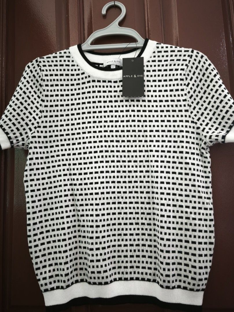 Apple & Eve Black and White Top (Category: Blouses) located in Legazpi City. Submitted by fhlorms (Listing ID 1395122125, Image 1). Description: New Apple & Eve top in size M. Features a black and white checkered pattern, short sleeves, and a round neckline with black trim. Made of knit material..