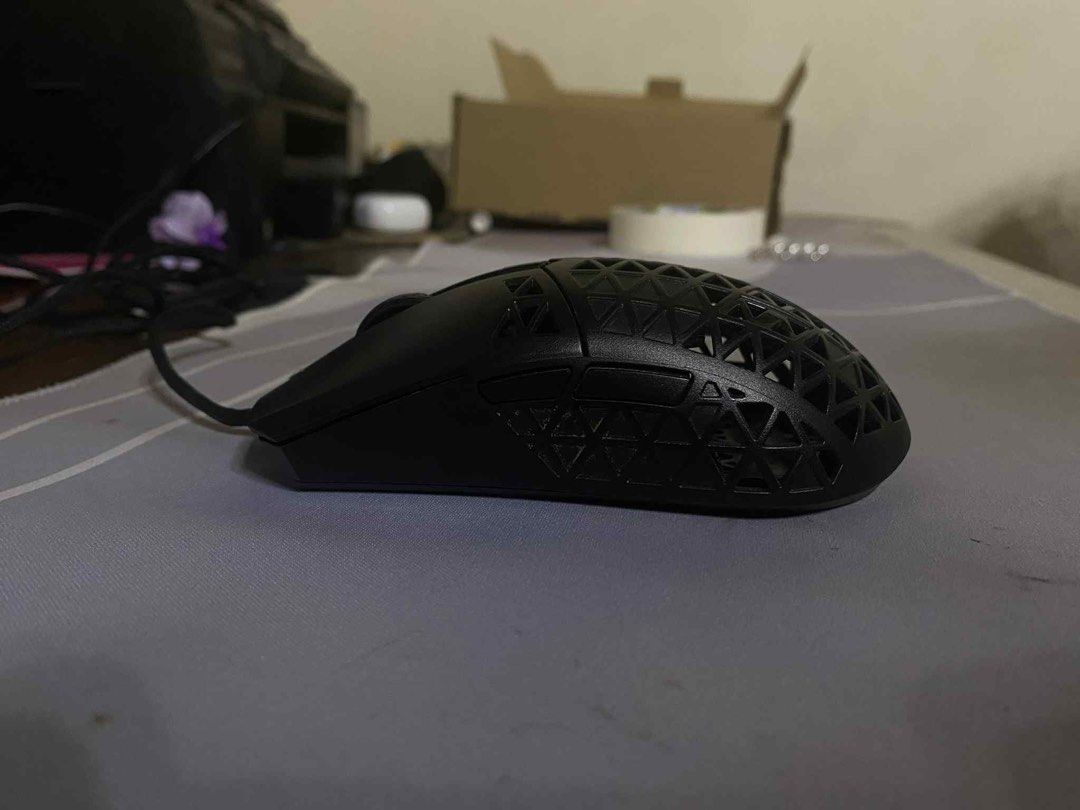Asus TUF M4 Air Wired Gaming Mouse (Category: Mouse & Mousepads) located in Manila. Submitted by dnoxiao (Listing ID 1395126410, Image 3). Description: **Condition:** Barely used, fully functional. No box or accessories included, only the mouse itself— although it will be presented to you in a box (plain) upon delivery. Originally bought at ₱2,750 * Ultralight design (only 47g) for faster and smoother movement * Ambidextrous form, comfortable for