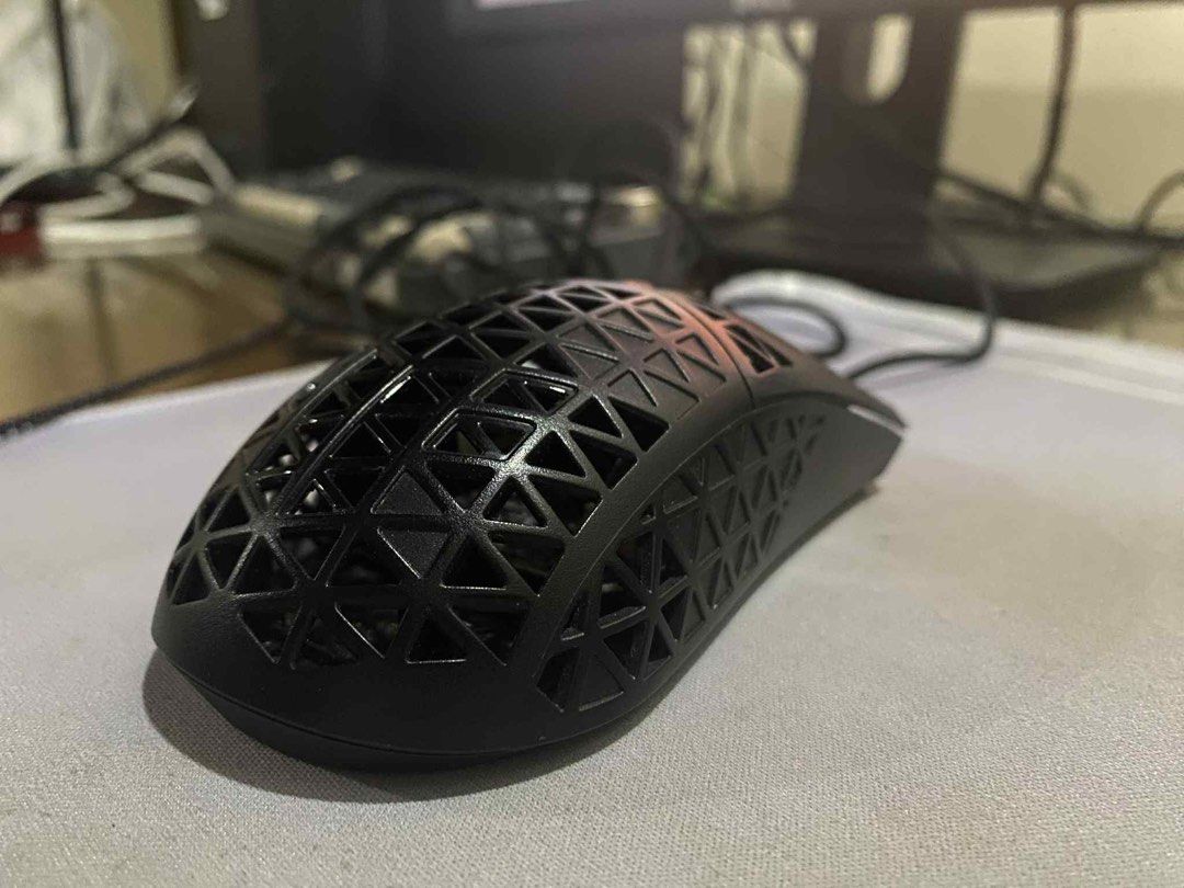Asus TUF M4 Air Wired Gaming Mouse (Category: Mouse & Mousepads) located in Manila. Submitted by dnoxiao (Listing ID 1395126410, Image 2). Description: **Condition:** Barely used, fully functional. No box or accessories included, only the mouse itself— although it will be presented to you in a box (plain) upon delivery. Originally bought at ₱2,750 * Ultralight design (only 47g) for faster and smoother movement * Ambidextrous form, comfortable for