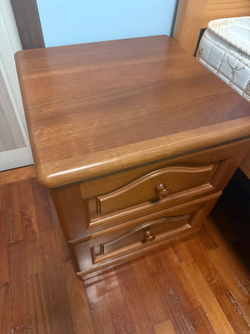 Bedside Table Solid Wood (Category: Tables & Sets) located in Singapore. Submitted by reesaas (Listing ID 1395092096, Image 2). Description: - Classic wooden nightstand - Two drawers for storage - Warm, natural wood finish - Smooth corners, safe edges - Smooth drawer operation - Solid and sturdy construction L43 x W44 x H51 cm Self-pickup or arrange own delivery.