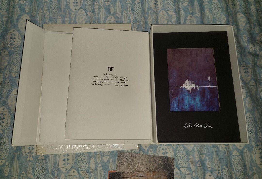 BTS BE Deluxe Edition Album with BE Notepad (Category: CDs & DVDs) located in Manila. Submitted by mpxlive (Listing ID 1395031039, Image 3). Description: - BTS BE Deluxe Edition album - Unsealed with a small dirt mark at the edge cause of storage. - Includes outer box, photo cards, and other inclusions - With folded poster - Choose one mini poster freebie from 2018 Summer Package in Saipan (Except Taehyung, Jimin, and Yoongi) Location: Cainta RFS