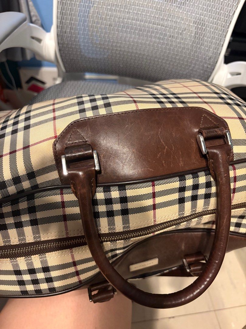 Authentic Burberry luggage bag (Category: Luxury Bags & Wallets) located in Manila. Submitted by carolynba49610 (Listing ID 1395085645, Image 3). Description: Burberry original Overnight bag or travel bag, pristine condition except for the regular scratches on the leather. No rubs on the edges . Clean inside. Mix of canvas and leather..