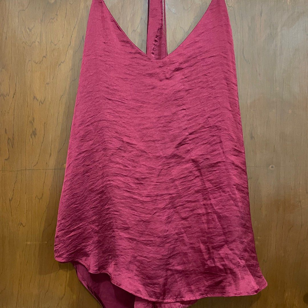Burgundy Halter Top (Category: Sleeveless) located in Valenzuela. Submitted by remoldedpashion (Listing ID 1395082868, Image 1). Description: - Burgundy halter top - V-neckline - Flowing, asymmetrical hem - Sleeveless - Halter strap ties at the back - Satin-like sheen.