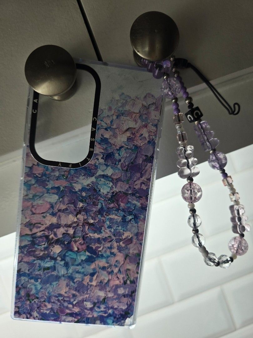 Casetify Phone case and charm (Category: Cases & Sleeves) located in Makati City. Submitted by everydaytrinkets (Listing ID 1395078857, Image 1). Description: - Casetify phone case and bead charm for S24 Ultra - Colorful abstract design phone case - Detachable bead strap (purple and clear beads) - Clear border - Camera cutout .