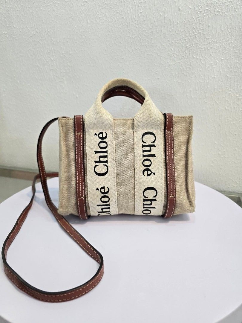 Chloe Woody Tote Bag (Category: Luxury Bags & Wallets) located in Davao. Submitted by luxben (Listing ID 1395149044, Image 1). Description: - Authentic Chloe Woody tote bag - Beige linen body - Brown leather trim and handles - Chloe logo detail - Made in Italy - Interior pocket with leather tag - Main Material: 100% Linen - Secondary Material: 100% Calf Leather.