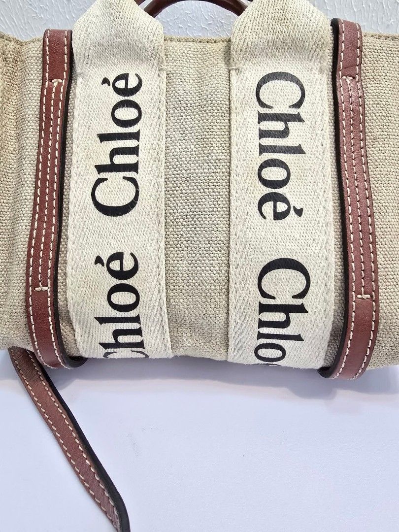 Chloe Woody Tote Bag (Category: Luxury Bags & Wallets) located in Davao. Submitted by luxben (Listing ID 1395149044, Image 2). Description: - Authentic Chloe Woody tote bag - Beige linen body - Brown leather trim and handles - Chloe logo detail - Made in Italy - Interior pocket with leather tag - Main Material: 100% Linen - Secondary Material: 100% Calf Leather.