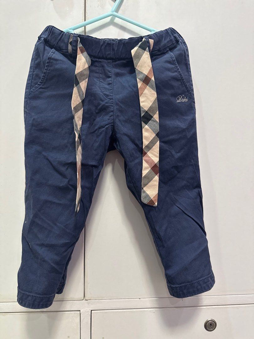 Daks Blue Pants with Plaid Detail (Category: Babies & Kids Fashion) located in Calasiao. Submitted by hollistic (Listing ID 1395115007, Image 1). Description: - Blue pants - Elastic waistband - Plaid detail on sides - Two front pockets - Small logo - Durable fabric - Suitable for everyday wear - Simple and stylish design.
