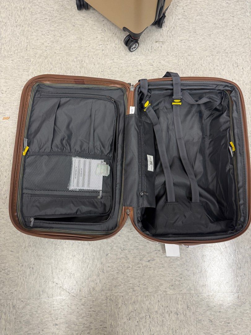 Delsey Paris Carry-on Suitcase (Category: Luggage) located in Quezon City. Submitted by nina287 (Listing ID 1395014216, Image 3). Description: - Delsey Paris carry-on suitcase - Blue exterior with textured design - Retractable handle and wheels for easy transport - Multiple interior compartments and straps - Combination lock for security - Delsey Paris logo visible.