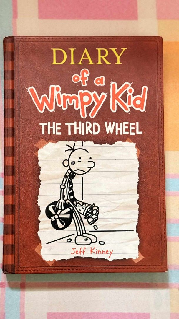 Diary of a Wimpy Kid: The Third Wheel (Category: Children's Books) located in Taguig. Submitted by xiaoriri (Listing ID 1395118055, Image 1). Description: - Diary of a Wimpy Kid: The Third Wheel - By Jeff Kinney - Features Greg Heffley on the cover - Hardbound edition - Great for kids and Wimpy Kid fans.