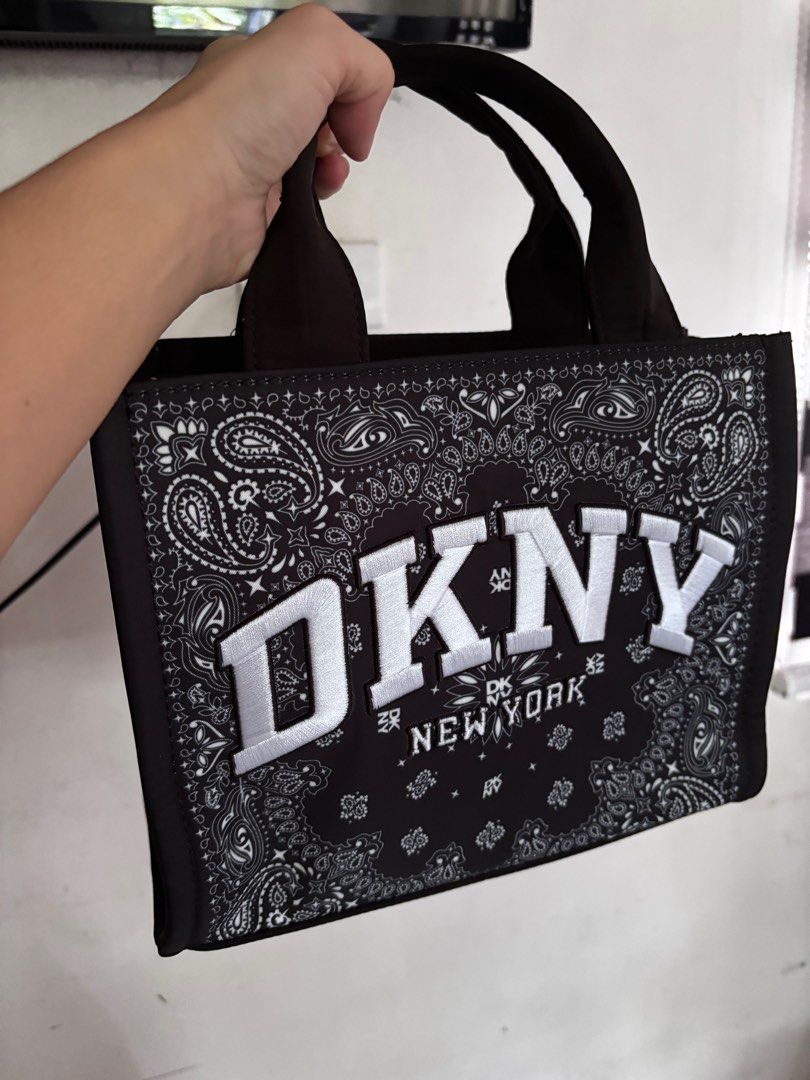DKNY Handbag with Paisley Design (Category: Luxury Bags & Wallets) located in San Pablo. Submitted by aceastra (Listing ID 1395034922, Image 1). Description: New arrival from US! Bnew and sealed dust bag included Free SF! 💕 - DKNY handbag - Stylish paisley pattern - Top handle design - DKNY logo on front - Made of sturdy material - Includes DKNY dust bag - Great for everyday use.