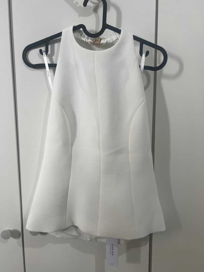 Ever new white top (Category: Sleeveless) located in Mandaluyong City. Submitted by miss_declutter321 (Listing ID 1394998670, Image 1). Description: Tried it only. Brand new.