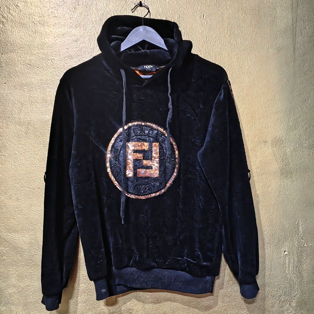 FENDI HOODIE JACKET (Category: Luxury Apparel) located in Baguio. Submitted by cc1516 (Listing ID 1386715998, Image 2). Description: -FENDI BLACK LOGO EMBROIDERED HOODIE JACKET -MADE OF VELOUR MATERIAL -DRAWSTRING HOOD -FENDI LOGO GOLD IN FRONT -MEDIUM IN SIZE -LIKE NEW -GOOD CONDITION.