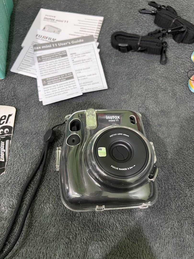 Fujifilm Instax Mini 11 Charcoal Gray (Category: Cameras) located in Quezon City. Submitted by beafinds (Listing ID 1395126411, Image 3). Description: - Fujifilm Instax Mini 11 instant camera (Charcoal Gray) - Includes original box and user's guide - Comes with a protective clear case - Features a camera strap - Includes a set of Energizer AA batteries - Ready to capture instant photos! FREE SHIPPING.