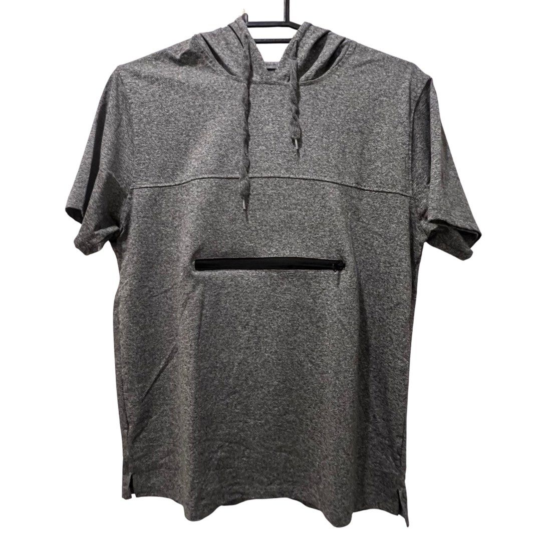 Gray Short Sleeve Hooded Shirt (Category: Activewear) located in Quezon City. Submitted by zhobby (Listing ID 1395064346, Image 1). Description: - Gray hooded shirt - Short sleeves - Front zipper pocket - Drawstring hood - Lightweight material - Simple design - Suitable for casual wear.