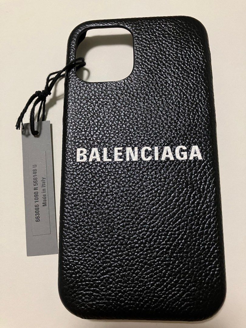 iPhone Case (Category: Cases & Sleeves) located in Singapore. Submitted by ahjibalang (Listing ID 1395129071, Image 1). Description: - Balenciaga iPhone case for 14, Might be able to fit 15 & 13 too. Free feel to try before purchase. - Includes original box, dust bag, and tags - Features Balenciaga logo - Excellent, unused condition.