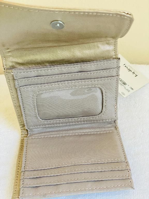 KIPLING CECE STARRY GOLD METALLIC ORGANIZER SMALL WALLET $42 (Category: Wallets & Card holders) located in San Juan City. Submitted by thesouthbeachedit (Listing ID 1394985699, Image 3). Description: 100% AUTHENTIC FROM THE u.s.! BRAND NEW WITH TAG! KIPLING CECE STARRY GOLD METALLIC WALLET STYLE: KI0951 3EV Nylon Dimensions: 4.25"L x 3.875"H x 0.5"D Weight: 0.176 lbs Snap closure ID slot 6 credit card slots Back zip pocket RFID technology DON'T L