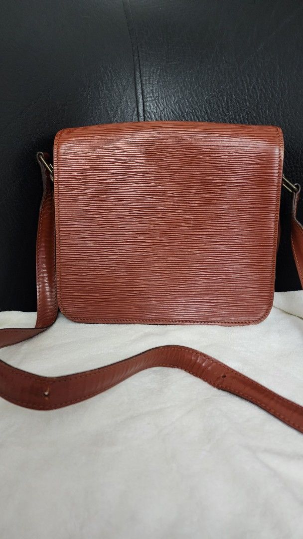 Louis Vuitton Epi Leather Shoulder Bag (Category: Luxury Bags & Wallets) located in Marilao. Submitted by curleylux (Listing ID 1394973153, Image 3). Description: - Vintage Louis Vuitton shoulder bag - Epi Leather in brown - Flap closure with buckle - Long shoulder strap - Leather interior - Interior logo stamp.