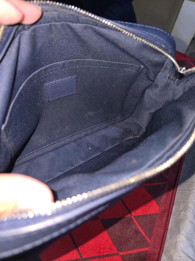 Louis Vuitton Sling Bag (Category: Luxury Bags & Wallets) located in Pasay City. Submitted by piaaaaa_952 (Listing ID 1395062000, Image 2). Description: - Navy blue sling bag - Features the Louis Vuitton logo - Main compartment and interior pockets - Zipper closure - Logo-printed strap - Navy blue interior lining.