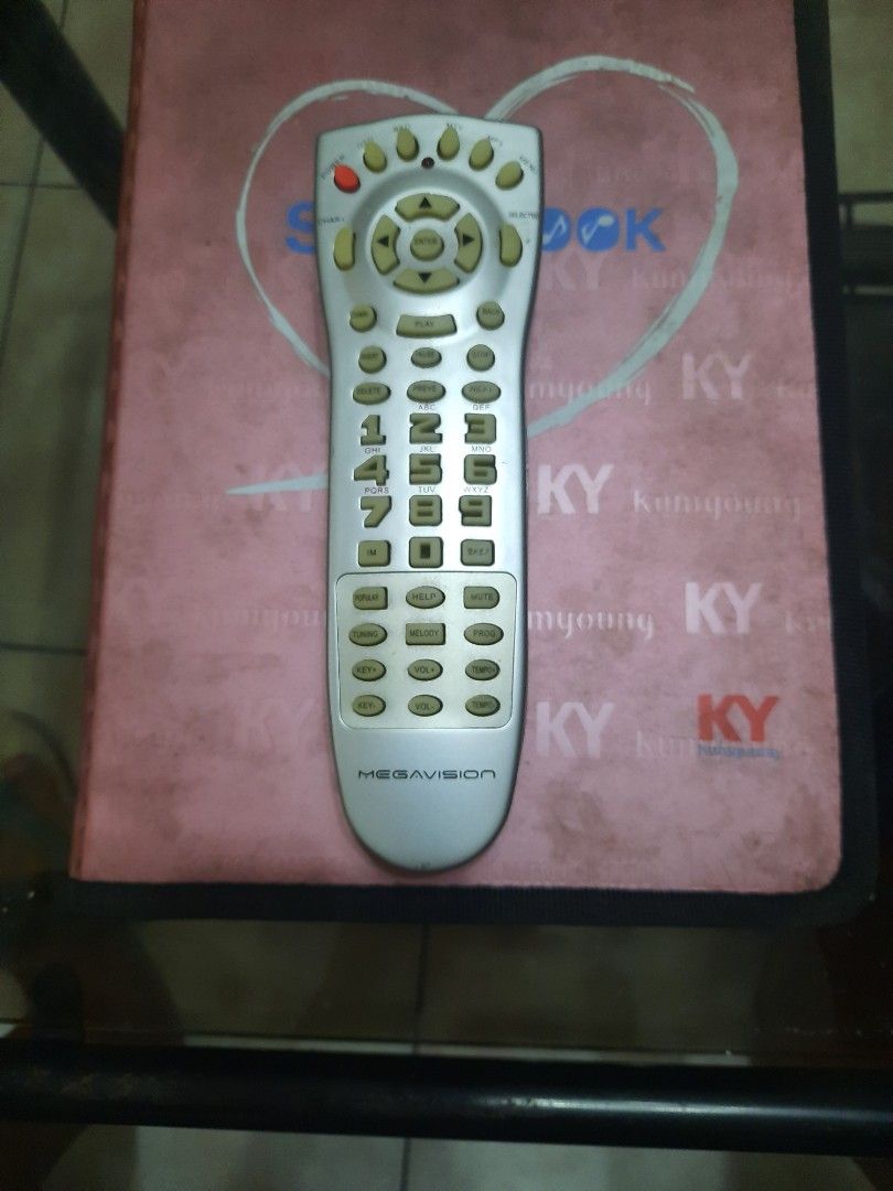 Megavision Remote Control (Category: TV Parts & Accessories) located in Quezon City. Submitted by henco (Listing ID 1394990011, Image 1). Description: - Megavision remote control (original) - Controls volume, tuning, and melody - Silver finish - Features various function buttons - pls call 09279956180 for fast transaction - Laloma QC.