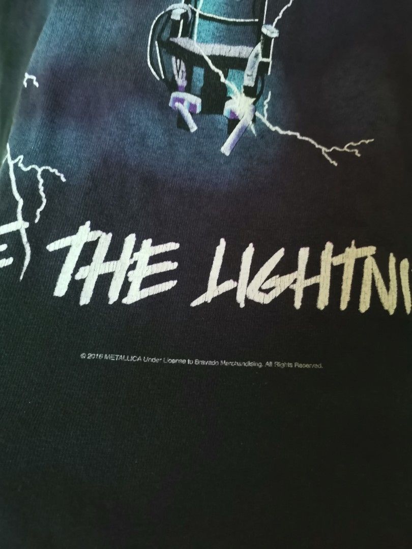 Metallica Ride The Lightning (Category: Tshirts & Polo Shirts ) located in Cebu City. Submitted by trex89 (Listing ID 1395020184, Image 3). Description: Black Metallica Ride The Lightning T-shirt. Features the album art on the front and back. The back graphic shows a man in an electric chair. The front graphic has the album title. The shirt has short sleeves. The copyright date is 2016..