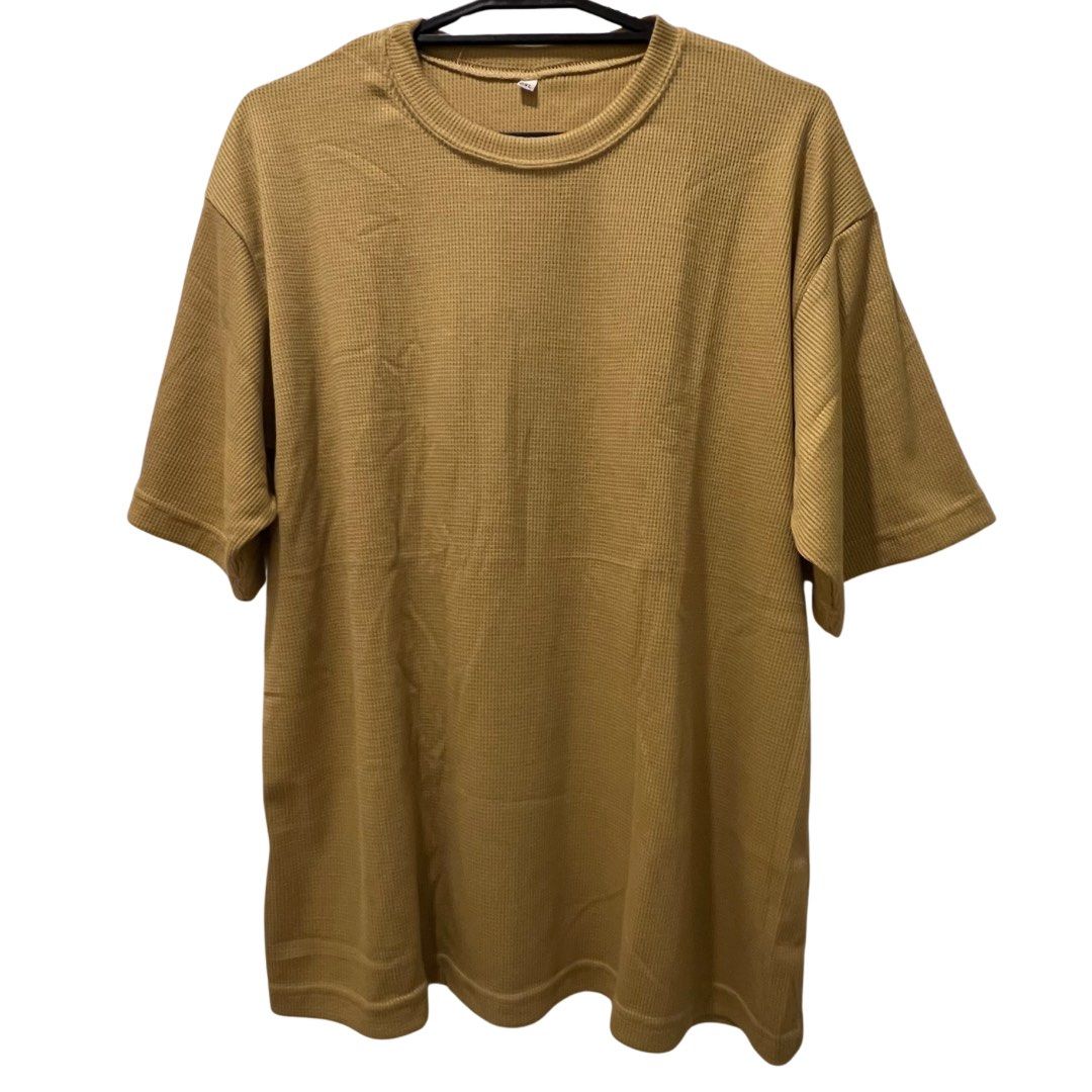Mustard Waffle Knit T-shirt (Category: Tshirts & Polo Shirts ) located in Quezon City. Submitted by zhobby (Listing ID 1395063312, Image 1). Description: - Mustard-colored t-shirt - Waffle knit texture - Crew neck - Short sleeves - Relaxed fit - Ribbed hem detail.