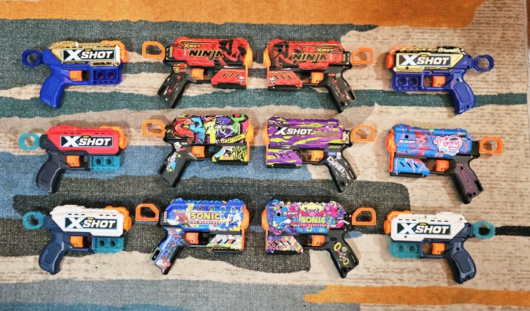 Nerf & X-Shot Toy Guns (Category: Action & Battle Toys) located in Quezon City. Submitted by northernlegends (Listing ID 1395154621, Image 2). Description: Collection of Nerf and X-Shot toy guns. Includes various models with different designs and colors. Some feature Fortnite and Roblox themes. Also includes X-Shot Ninja and Sonic the Hedgehog designs. Perfect for kids who love to play with toy guns. Location Commonwealth QC MOP GCash, BDO, BPI M