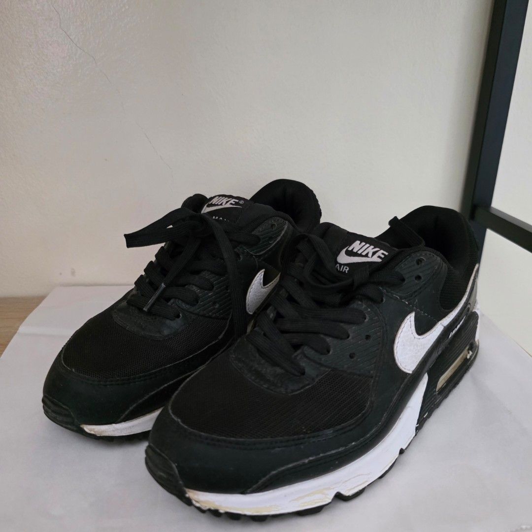 Nike Air Max 90 Black and White (Category: Sneakers) located in Mandaluyong City. Submitted by kunigpicks (Listing ID 1395049135, Image 2). Description: Condition: 7/10 (outer bakbak due to storage, but interior is in good condition Payment via: Maya/Gcash/Bank Transfer Nike Air Max 90 sneakers in black and white. Features the iconic Air Max design with visible air unit. Includes the Nike logo on the side and "Air Max" branding on the heel. Size 