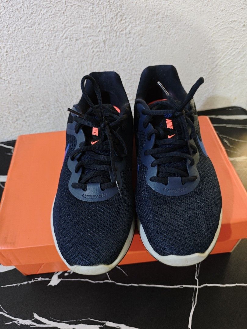 Nike Revolution 6 Running Shoes (Category: Activewear) located in Del Monte. Submitted by seleriii (Listing ID 1395027785, Image 3). Description: - Nike Revolution 6 running shoes - Color: Navy blue with white sole - Features blue Nike swoosh - Navy blue laces - Includes original orange box -size 8.5.