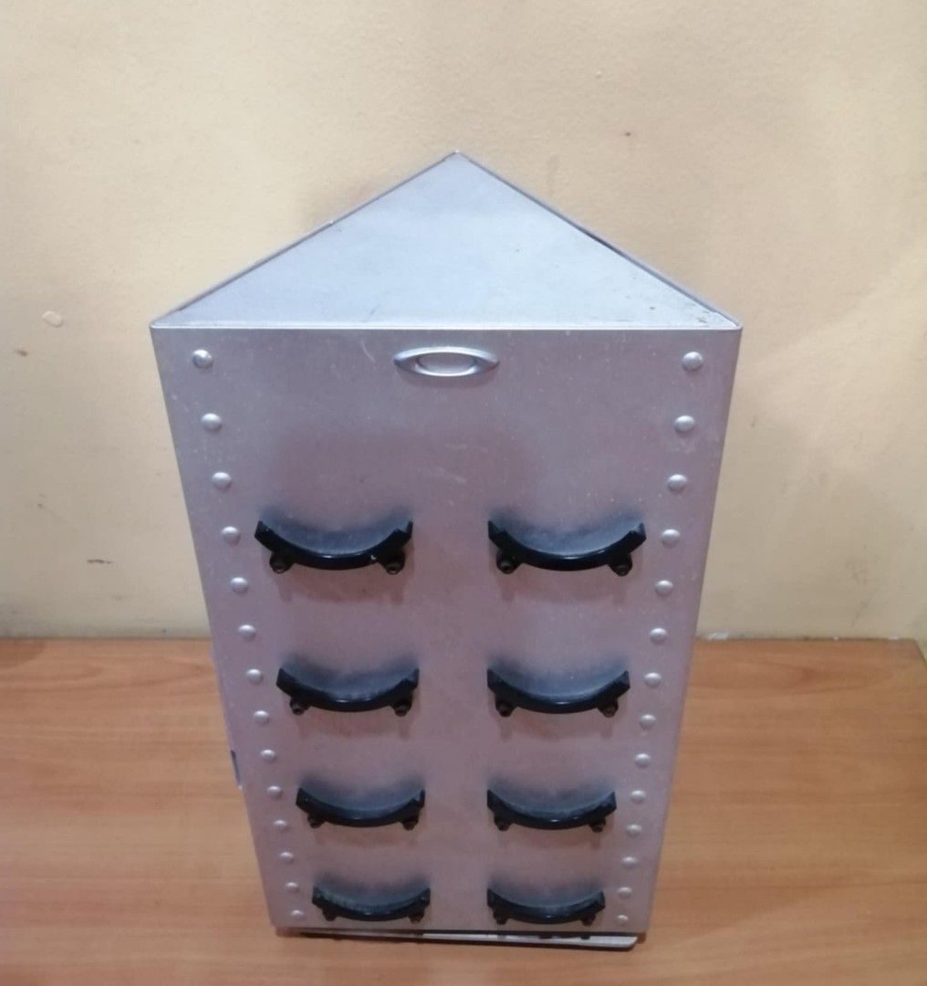 OAKLEY Vintage Lense/Coin Stand (Category: Vintage Collectibles) located in Cainta. Submitted by Bishop555 (Listing ID 1395015293, Image 2). Description: Late 80s to 90s Oakley Lense display stand (about 12 inches in height, Rotating stand) Bought Abroad, (NOT LOCAL) Diamond type about 7 inches each side. Great for Oakley collectors in great condition, If you love collecting Oakley Coins best to hold em here. 15k Nego!.