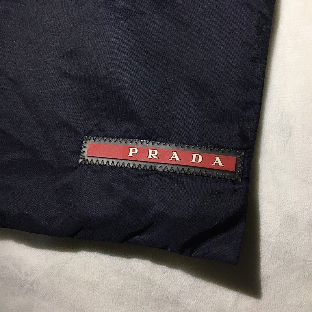 Authentic Prada Red Tab Pouch (Category: Luxury Bags & Wallets) located in Paranaque City. Submitted by dresswell.ph (Listing ID 1395102889, Image 2). Description: Prada Red Tab Pouch Authentic Like new condition No flaws Measurements: Width - 10 inches Height - 8 inches.