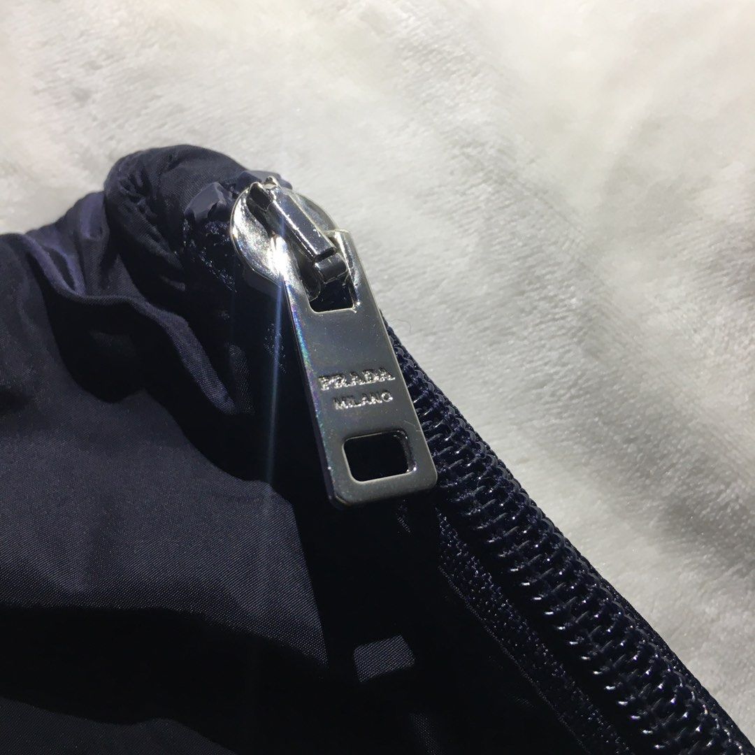 Authentic Prada Red Tab Pouch (Category: Luxury Bags & Wallets) located in Paranaque City. Submitted by dresswell.ph (Listing ID 1395102889, Image 3). Description: Prada Red Tab Pouch Authentic Like new condition No flaws Measurements: Width - 10 inches Height - 8 inches.