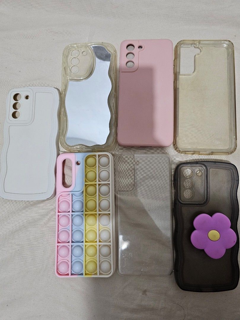 Samsung S21 5G Cases Bundle of 7 (Category: Cases & Sleeves) located in Makati City. Submitted by gracielle24 (Listing ID 1395143401, Image 1). Description: All Cases are used but bot abused. Lady Owned Bundle of 7 only Selling it due to phone upgrade.