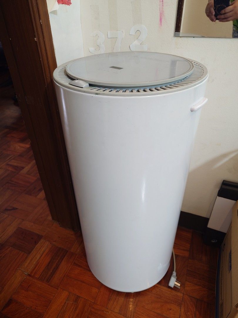 Smart Clothing Disinfection Dryer (Category: Washing Machines and Dryers) located in Manila. Submitted by chase168 (Listing ID 1395014428, Image 3). Description: - Smart clothing disinfection dryer - Sanitizes and dries clothes - Circular design - Control panel and door for loading - White, cylindrical shape - Brand name visible -UV function - Automatic -Good for baby clothes especially the UV function (up to 8 onesies) - 2-3 shirts in one go or 
