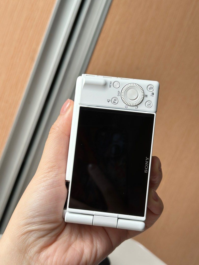 Sony ZV-1F Digital Camera (Category: Cameras) located in Makati City. Submitted by nessaolx (Listing ID 1394990307, Image 2). Description: - Sony ZV-1F digital camera (white) - Features a flip-out screen Inclusions: - 1 Battery - charger for 3 batteries w/ type-c cord - 64gig SD card - purple silicone case - mic furry wind muff * No box.