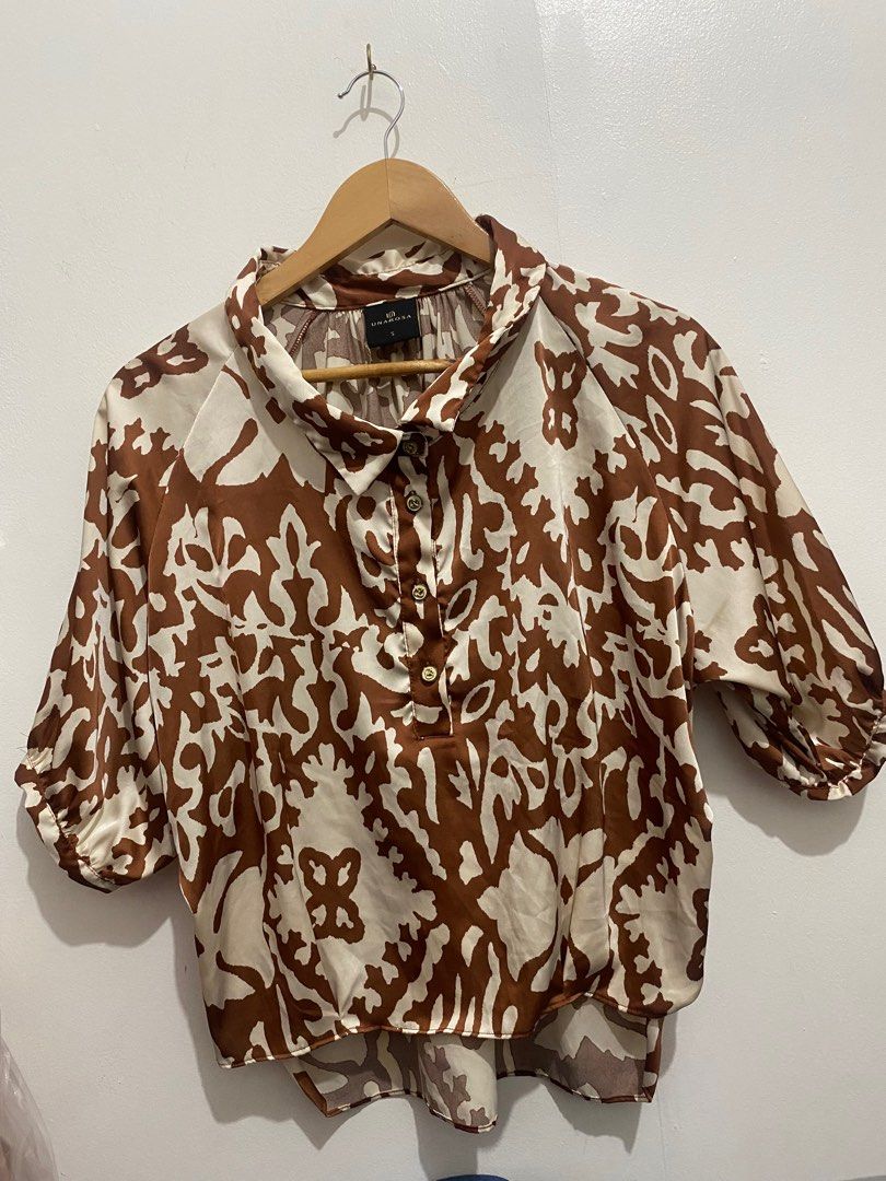 Unarosa Brown and White Blouse (Category: Blouses) located in Manila. Submitted by zapitup (Listing ID 1395123068, Image 1). Description: - Unarosa blouse bought at SM - Size: Small - Unique brown and white pattern - Collared neckline - Button details - Three-quarter sleeves Original price 1499 Worn 2x .