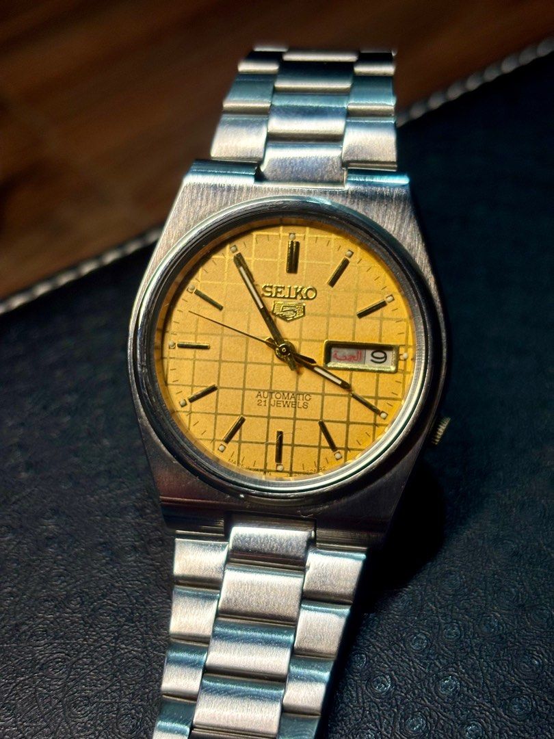 Vintage Seiko 5 Grid Dial Automatic Wrist Watch (Category: Men's Watches) located in Marikina City. Submitted by marceljdo (Listing ID 1379949389, Image 1). Description: Seiko 5 Golden Grid Dial Vintage Watch JDM Very Good Condition ++ English / Arab Day Date 7009 - 7S26 transition rare model 1980’s vibe! GCash. / BankTransfer / Lalamove .