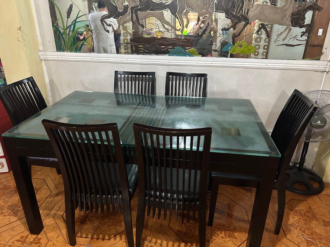 6 seater Tempered Glass Thick Dining Table Set (Category: Tables & Sets) located in Navotas City. Submitted by jaldeclutters (Listing ID 1395267723, Image 1). Description: issue: 1 chair needs upholstery/repair need palitan yung wood underneath. size: 150x90cm super tibay and maganda. negotiable rfs: moving out.