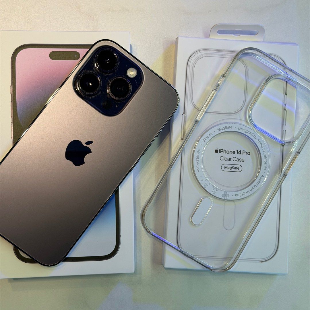 (Category: iPhone 14 Series) located in Singapore. Submitted by sportb1ke (Listing ID 1395231071, Image 1). Description: - iPhone 14 Pro - Deep purple 256gb - Battery Health: 100% - Included: Original box and all accessories - Included: Apple clear MagSafe case - Included: tempered glass screen protector - Condition: Excellent - Purchase date: 15 Sep 2022 - Battery change: 1 Feb 2025 - Both iPhone purchase and battery change were done at Apple St
