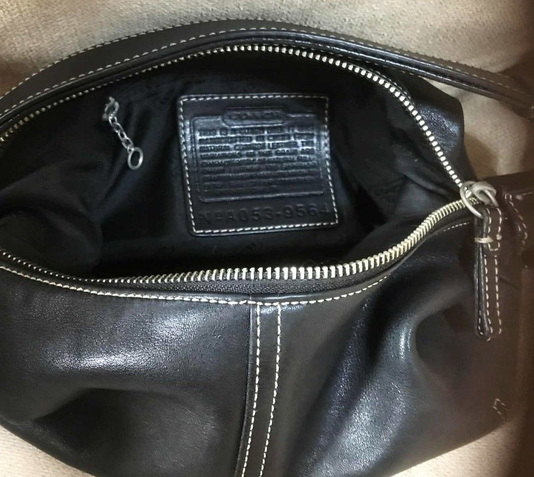 Coach Black Leather Shoulder Bag (Category: Luxury Bags & Wallets) located in Manila. Submitted by bravebird.ea924a (Listing ID 1395185692, Image 2). Description: - Coach black leather shoulder bag - Zip closure - White stitching details - Silver-tone hardware - Single shoulder strap - Made of genuine leather - Includes Coach tag with serial number.