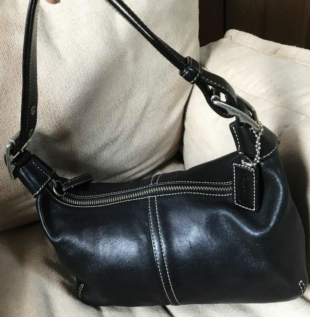 Coach Black Leather Shoulder Bag (Category: Luxury Bags & Wallets) located in Manila. Submitted by bravebird.ea924a (Listing ID 1395186985, Image 2). Description: - Black leather shoulder bag - White stitching detail - Zippered main compartment - Adjustable shoulder strap - Silver-tone hardware - Black fabric interior lining - Includes Coach tag.