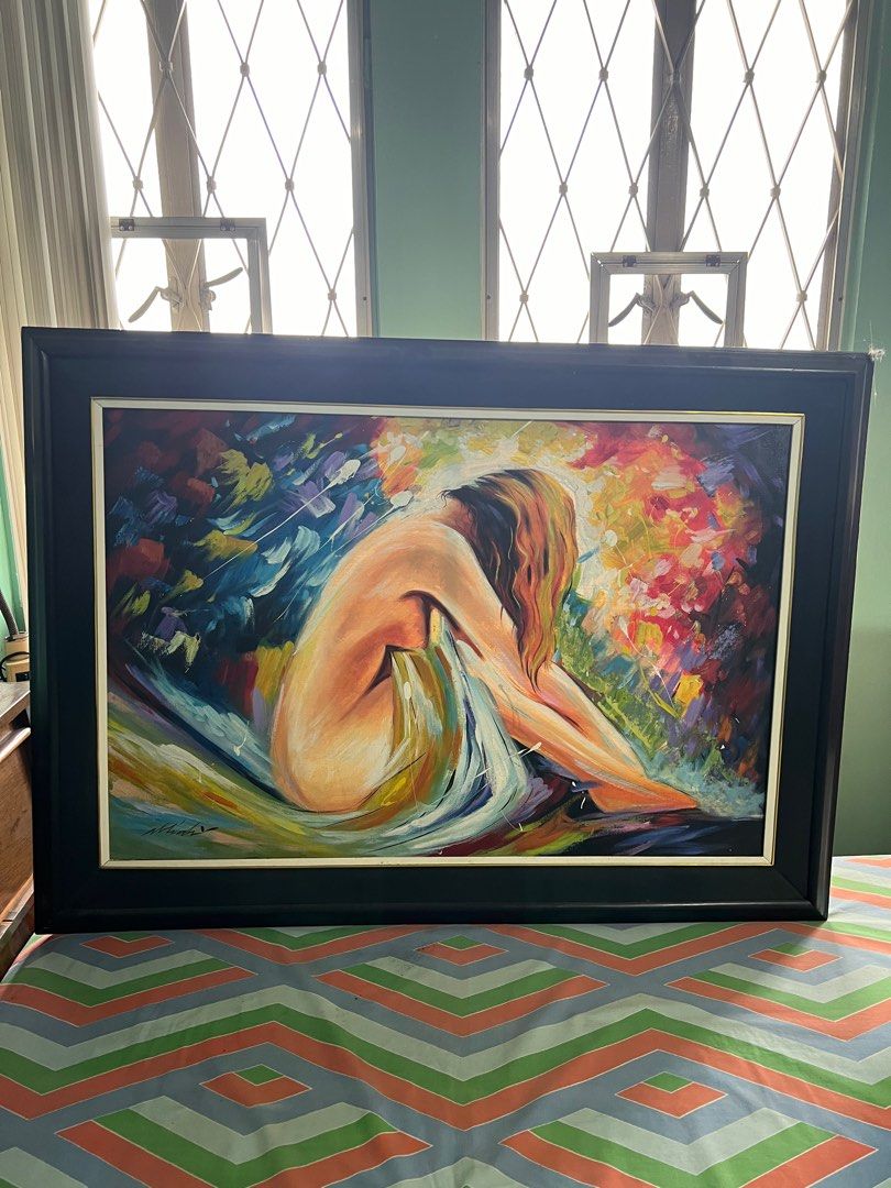 Framed Nude Oil Painting (Category: Art & Prints) located in Paranaque City. Submitted by sunnysideupsunday (Listing ID 1395187852, Image 2). Description: - Original oil painting - Features a nude figure - Framed in a black wooden frame - Colorful background - Artist's signature visible - Ideal for art collectors and home decor.