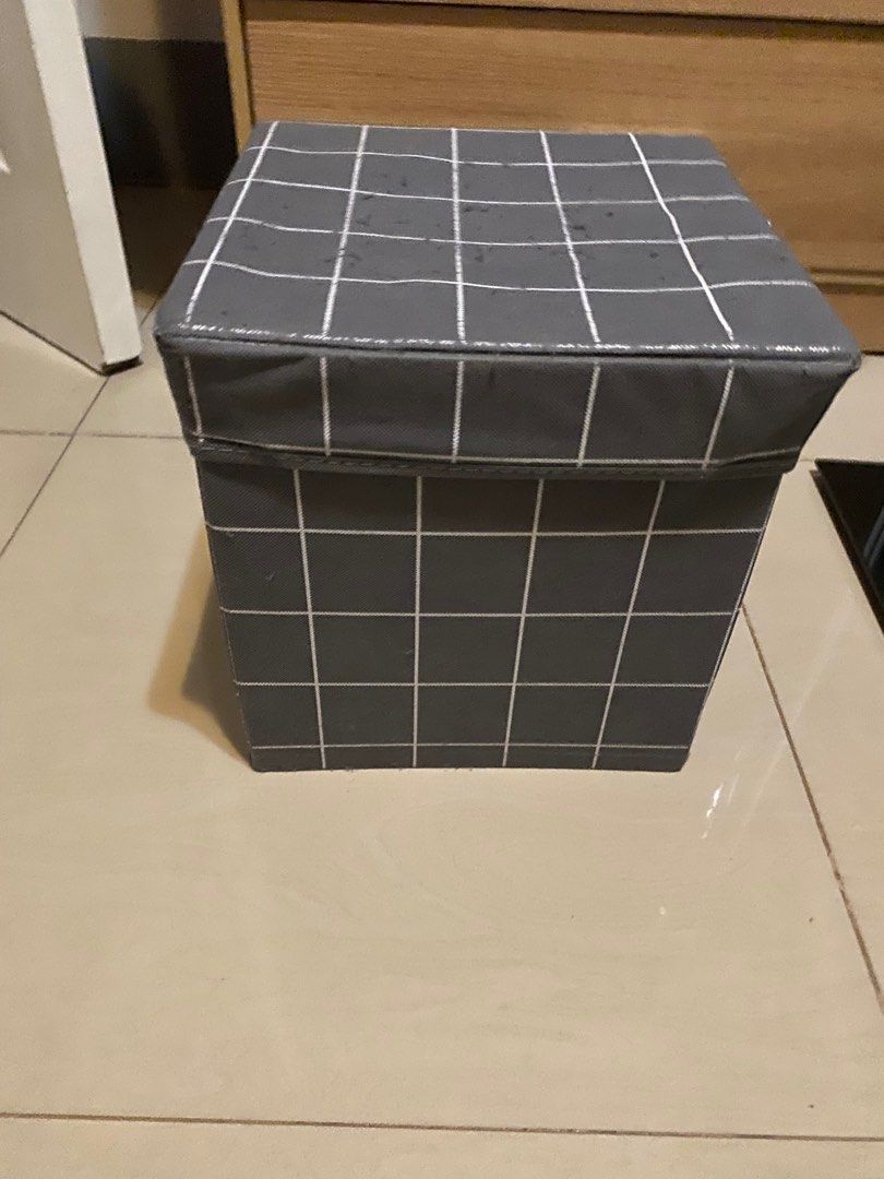 Grey Grid Storage Box (Category: Storage Boxes & Baskets) located in Manila. Submitted by irenelimto72098 (Listing ID 1395324888, Image 2). Description: - Grey grid pattern - Fabric storage box - Includes a lid - Square shape - Perfect for home organization - Space-saving design - Suitable for storing various items.