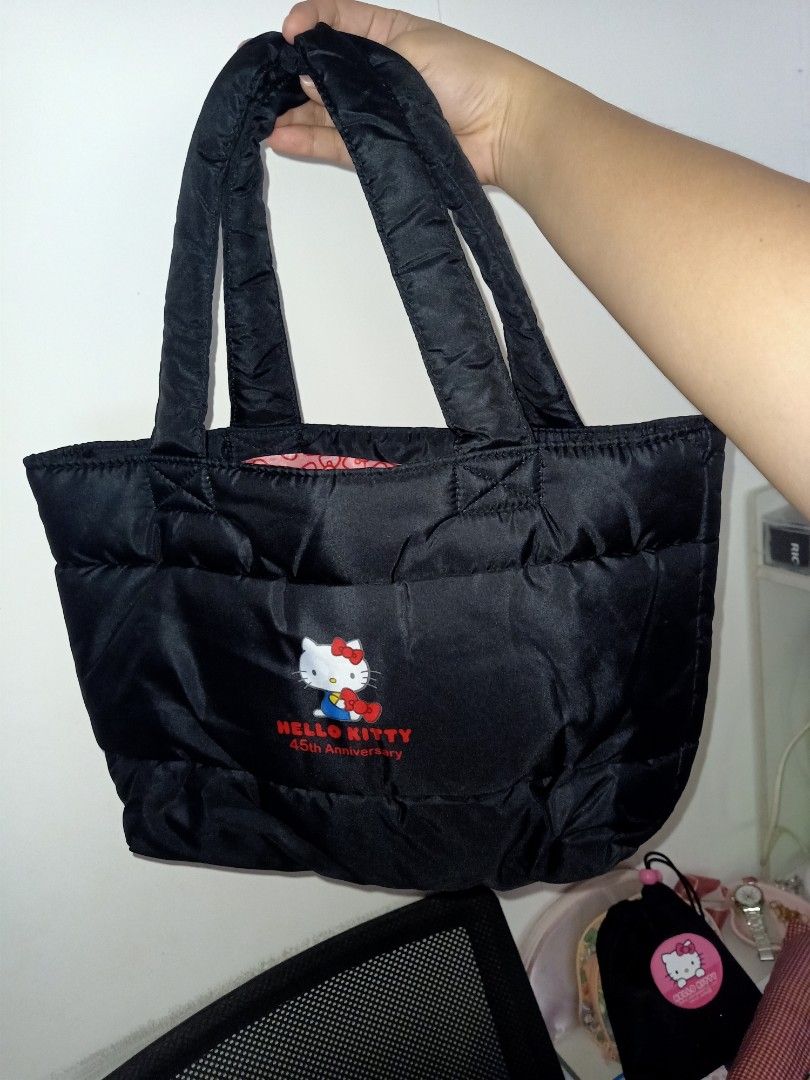 Hello Kitty Puffy Tote Bag (Category: Tote Bags) located in Bulacan. Submitted by baee__ (Listing ID 1395163090, Image 3). Description: - Kitty tote bag - Features a large red bow design - Padded handles for comfort - Red interior with Kitty patterns - Made of quilted material.