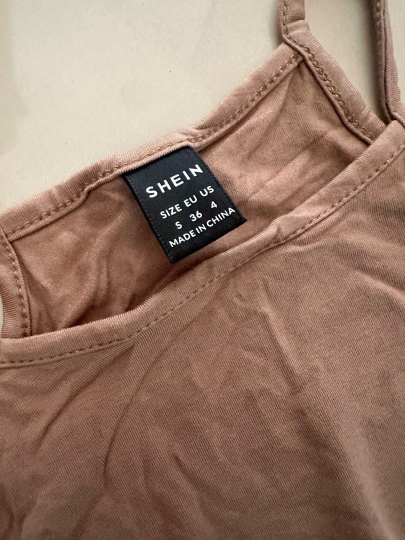SHEIN Halter Neck Bodysuit - Size S (Category: Others Tops) located in Manila. Submitted by cazly (Listing ID 1395211049, Image 3). Description: Never used!! - SHEIN Halter Neck Bodysuit - Color: Brown - Size: S - Features a thong bottom - Made in China - Simple and versatile design.
