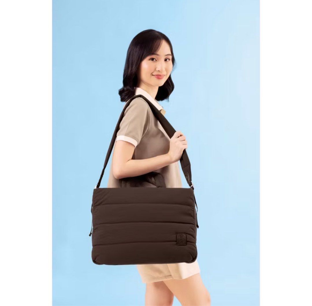 Straightforward Puffy Tote Bag Laptop Bag (Category: Tote Bags) located in Mandaluyong City. Submitted by junos.mnl (Listing ID 1395181355, Image 1). Description: - Chestnut color quilted tote bag / laptop bag - Top handles and detachable shoulder strap - Padded design - Features a logo patch - Spacious enough for a laptop and essentials - Perfect for everyday use - Bought this September 2025 and used once only - comes with plastic and white cove
