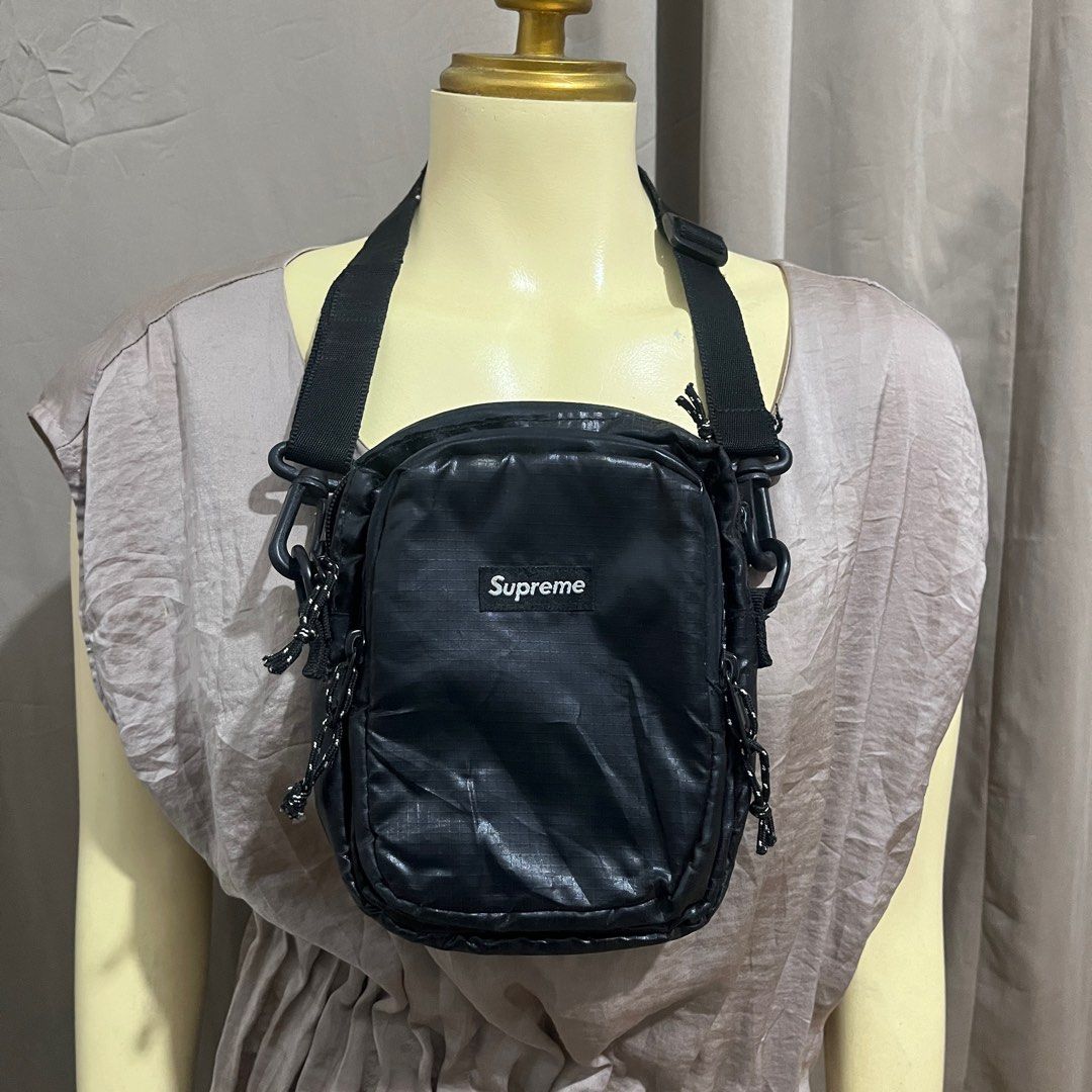 Supreme Fw17 Shoulder SlingBag Black (Category: Luxury Bags & Wallets) located in Butuan. Submitted by dfgthriftology2.0 (Listing ID 1395343003, Image 2). Description: - Black Supreme shoulder bag - Main compartment and front pocket - Adjustable shoulder strap - Clip on each side - Supreme logo on the front - Made in China Front Pocket :4.25* XY*X6” Back Pocket:6.5*X2”X8” .