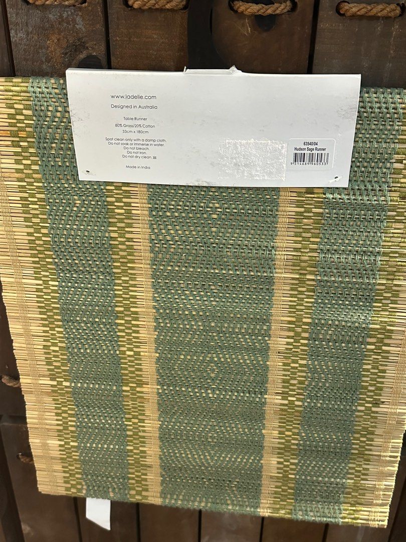 Table runner (Category: Table Linen & Textiles) located in Singapore. Submitted by bruno_teo (Listing ID 1395279554, Image 2). Description: - Stylish table runner - Features a woven design - Color: Green and natural tones - Adds elegance to your dining table -33cm x 180cm.